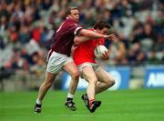 29 April 2001; Eoin Sexton of Cork is tackled by Damien Healy of Westmeath during the Allianz GAA National Football League Division 2 Final match between Westmeath and Cork at Croke Park in Dublin. Photo by Ray Lohan/Sportsfile