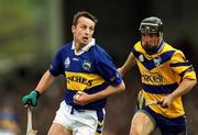 6 May 2001; Brian O'Meara of Tipperary races clear of Gerry Quinn of Clare during the Allianz National Hurling League Final match between Tipperary and Clare at the Gaelic Grounds in Limerick. Photo by Ray McManus/Sportsfile