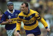 6 May 2001; Ollie Baker of Clare gets away from Eoin Kelly of Tipperary during the Allianz National Hurling League Final match between Tipperary and Clare at the Gaelic Grounds in Limerick. Photo by Ray McManus/Sportsfile