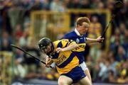 6 May 2001; Frank Lohan of Clare gets away from Declan Ryan of Tipperary during the Allianz National Hurling League Final match between Tipperary and Clare at the Gaelic Grounds in Limerick. Photo by Brendan Moran/Sportsfile