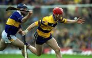 6 May 2001; Brian Lohan of Clare gets away from Eoin Kelly of Tipperary during the Allianz National Hurling League Final match between Tipperary and Clare at the Gaelic Grounds in Limerick. Photo by Brendan Moran/Sportsfile *** Local Caption ***