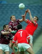 29 April 2001; Westmeath players Damien Gavin and Michael Ennis, left, contest a high ball against Cork players Nicholas Murphy and Martin Cronin, 7, during the Allianz GAA National Football League Division 2 Final match between Westmeath and Cork at Croke Park in Dublin. Photo by Ray McManus/Sportsfile