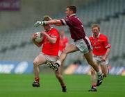 29 April 2001; Michael O'Donovan of Cork in action against David Mitchell of Westmeath during the Allianz GAA National Football League Division 2 Final match between Westmeath and Cork at Croke Park in Dublin. Photo by Ray Lohan/Sportsfile