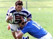 12 May 2001; Brywn Cunnigham of Dungannon is tackled by Seamus MacKay of Garryowen during the AIB All-Ireland League Division 1 match between Dungannon RFC and Garryowen RFC at Stevenson Park in Dungannon, Tyrone. Photo by Sportsfile