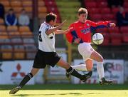 6 May 2001; Richie Baker of Shelbourne gets over the tackle of Kelvin Flanagan of Cork City during the Eircom League Premier Division match between Shelbourne and Cork City at Tolka Park in Dublin. Photo by David Maher/Sportsfile