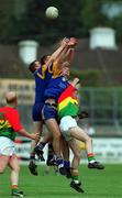 13 May 2001; Wicklow players, from left, Gary Jameson, Barry Sheehan and Darren Coffey contest possession against John McGrath of Carlow during the Bank of Ireland Leinster Senior Football Championship First Round match between Carlow and Wicklow at St Conleth's Park in Newbridge, Kildare. Photo by Matt Browne/Sportsfile