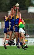13 May 2001; Wicklow players, from left, Darren Coffey, Gary Jameson and Barry Sheehan in action against John McGrath of Carlow during the Bank of Ireland Leinster Senior Football Championship First Round match between Carlow and Wicklow at St Conleth's Park in Newbridge, Kildare. Photo by Matt Browne/Sportsfile