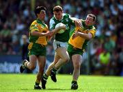 13 May 2001; Paul Brewster of Fermanagh is challenged by Mark Crossaan and John Gildea, right, of Donegal during the Bank of Ireland Ulster Senior Football Championship Preliminary Round match between Donegal and Fermanagh at MacCumhaill Park in Ballybofey, Donegal. Photo by Damien Eagers/Sportsfile