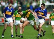 13 May 2001; Maurice Fitzgerald of Kerry gets away from the challenge of Damian O'Brien of Tipperary during the Bank of Ireland Munster Senior Football Championship Quarter-Final match between Tipperary and Kerry at Ned Hall Park in Clonmel, Tipperary. Photo by Brendan Moran/Sportsfile