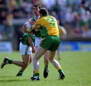 13 May 2001; Raymond Johnston of Fermanagh in action against Paul McGonigle of Donegal during the Bank of Ireland Ulster Senior Football Championship Preliminary Round match between Donegal and Fermanagh at MacCumhaill Park in Ballybofey, Donegal. Photo by Damien Eagers/Sportsfile