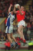 13 May 2001; Nicholas Murphy of Cork wins possession ahead of Karl O'Keefe of Waterford during the Bank of Ireland Munster Senior Football Championship Quarter-Final match between Cork and Waterford at Páirc Uí Chaoimh in Cork. Photo by Ray McManus/Sportsfile