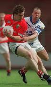 13 May 2001; Eoghan Sexton of Cork in action against Liam Dalton of Waterford during the Bank of Ireland Munster Senior Football Championship Quarter-Final match between Cork and Waterford at Páirc Uí Chaoimh in Cork. Photo by Ray McManus/Sportsfile