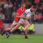 13 May 2001; Gary Hurney of Waterford is tackled by Nicholas Murphy of Cork during the Bank of Ireland Munster Senior Football Championship Quarter-Final match between Cork and Waterford at Páirc Uí Chaoimh in Cork. Photo by Ray McManus/Sportsfile