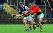 29 April 2001; David Cuddy of Laois in action against Pauric Keogh of Carlow during the Guinness Leinster Senior Hurling Championship Preliminary Round match between Carlow and Laois at Dr Cullen Park in Carlow. Photo by Damien Eagers/Sportsfile