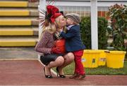 16 March 2016; Freddie Wilkinson, age 2, gives a kiss to his mother Michelle Foley, from Nottingham, England, ahead of day 2 of the races. Prestbury Park, Cheltenham, Gloucestershire, England. Picture credit: Cody Glenn / SPORTSFILE
