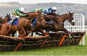 16 March 2016; Diamond King, right, with Davy Russell up, clears the last ahead of Blazer, with Barry Geraghty, left, and Ubak, with Joshua Moore up, on their way to winning the Coral Cup Hurdle. Prestbury Park, Cheltenham, Gloucestershire, England. Picture credit: Cody Glenn / SPORTSFILE