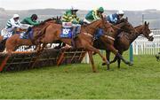 16 March 2016; Diamond King, right, with Davy Russell up, clears the last ahead of Blazer, left, with Barry Geraghty up, who finished fourth, and Ubak, with Joshua Moore up, who finished third, on their way to winning the Coral Cup Hurdle. Prestbury Park, Cheltenham, Gloucestershire, England. Picture credit: Cody Glenn / SPORTSFILE
