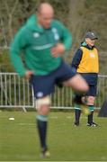 17 March 2016; Ireland head coach Joe Schmidt watches on as Rory Best goes through some stretching exercises during squad training. Carton House, Maynooth, Co. Kildare. Picture credit: David Maher / SPORTSFILE