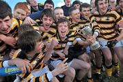 10 March 2010; Colaiste Eoin captain Roibeard Mac Daibhéad, centre, and his team-mates celebrate with the cup. Dublin School Junior Football A Final, St Benildus College v Colaiste Eoin, UCD, Belfield, Dublin. Picture credit: Brian Lawless / SPORTSFILE