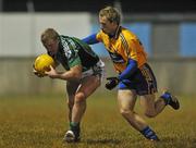 10 March 2010; James Kelly, Limerick, in action against Enda Lyons, Clare. Cadbury Munster GAA Football Under 21 Quarter-Final, Limerick v Clare, Cooraclare GAA Club, Co. Clare. Picture credit: Diarmuid Greene / SPORTSFILE