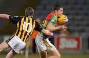 10 March 2010; Brendan Murphy, Carlow, is tackled by Michael Malone, Kilkenny. Cadbury Leinster GAA Football Under 21 Quarter-Final, Carlow v Kilkenny, O'Moore Park, Portlaoise, Co. Laois. Picture credit: Matt Browne / SPORTSFILE