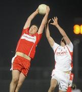 10 March 2010; Emmett McGuckian, Derry, in action against Kyle Coney, Tyrone. Cadbury Ulster GAA Football Under 21 Championship, Preliminary Round, Tyrone v Derry, Healy Park, Omagh, Co. Tyrone. Picture credit: Oliver McVeigh / SPORTSFILE