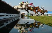 17 March 2016; A general view of the field clearing the water jump during the Ryanair Steeple Chase won by Vauntour, with Ruby Walsh up, hidden. Prestbury Park, Cheltenham, Gloucestershire, England. Picture credit: Cody Glenn / SPORTSFILE