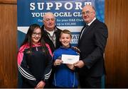 17 March 2016; GAA Vice President and Chairman of Leinster Council John Horan presents Art O'Reilly, Julie and Cian McEnroe, who represented the winner Killian O’Reilly, Mountnugent GAA Club, Mountnugent, Co Cavan, who won an All-Ireland Football Final Package 2016, during the presentation of prizes to the winners of the GAA National Club Draw. Nally Suite, Croke Park, Dublin. Picture credit: Ray McManus / SPORTSFILE