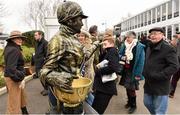 18 March 2016; Living statue Pamela Ferguson startles racegoers ahead of day 4 at the races. Prestbury Park, Cheltenham, Gloucestershire, England. Picture credit: Cody Glenn / SPORTSFILE
