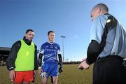 7 March 2010; Team captains Ryan McMenamin, Tyrone, left, and Vincent Corey, Monaghan, listen to referee Martin Higgins, before the match. Allianz GAA Football National League, Division 1, Round 3, Monaghan v Tyrone, Inniskeen GAA Grounds, Inniskeen, Co. Monaghan. Picture credit: Brian Lawless / SPORTSFILE