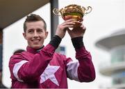 18 March 2016; Bryan Cooper celebrates with the Gold Cup after winning the Timico Cheltenham Gold Cup Steeple Chase on Don Cossack. Prestbury Park, Cheltenham, Gloucestershire, England. Picture credit: Cody Glenn / SPORTSFILE