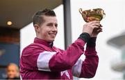 18 March 2016; Bryan Cooper celebrates with the Gold Cup after winning the Timico Cheltenham Gold Cup Steeple Chase on Don Cossack. Prestbury Park, Cheltenham, Gloucestershire, England. Picture credit: Cody Glenn / SPORTSFILE