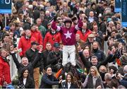 18 March 2016; Jockey Bryan Cooper celebrates as he enters the winners' enclosure after winning the Timico Cheltenham Gold Cup Steeple Chase on Don Cossack. Prestbury Park, Cheltenham, Gloucestershire, England. Picture credit: Cody Glenn / SPORTSFILE