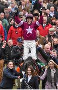 18 March 2016; Bryan Cooper celebrates with trainer Gordon Elliott, second from right, and the winning connections after victory in the Timico Cheltenham Gold Cup Steeple Chase on Don Cossack. Prestbury Park, Cheltenham, Gloucestershire, England. Picture credit: Cody Glenn / SPORTSFILE