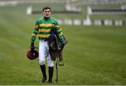18 March 2016; A dejected Jody McGarvey walks back to the shoot having fallen from Montdragon during the Martin Pipe Conditional Jockeys' Handicap Hurdle. Prestbury Park, Cheltenham, Gloucestershire, England. Picture credit: Seb Daly / SPORTSFILE
