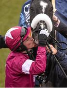 18 March 2016; Bryan Cooper kisses the Don Cossack after winning the Timico Cheltenham Gold Cup Steeple Chase. Prestbury Park, Cheltenham, Gloucestershire, England. Picture credit: Cody Glenn / SPORTSFILE