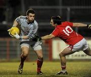 13 March 2010; Jonathan Curran, Tyrone, in action against Paul Kerrigan, Cork. Allianz GAA Football National League, Division 1, Round 4, Tyrone v Cork, Healy Park, Omagh, Co. Tyrone. Picture credit: Oliver McVeigh / SPORTSFILE