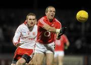 13 March 2010; Paudie Kissane, Cork, in action against Aidan Cassidy, Tyrone. Allianz GAA Football National League, Division 1, Round 4, Tyrone v Cork, Healy Park, Omagh, Co. Tyrone. Picture credit: Oliver McVeigh / SPORTSFILE