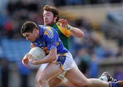 14 March 2010; Philip Austin, Tipperary, in action against Michael Burke, Meath. Allianz GAA Football National League, Division 2, Round 4, Tipperary v Meath, Semple Stadium, Thurles, Co. Tipperary. Picture credit: Brian Lawless / SPORTSFILE
