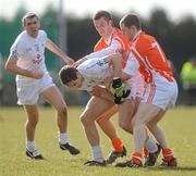 14 March 2010; Gary White, Kildare, in action against Paul Kernan and Finnian Moriarty, Armagh. Allianz GAA Football National League, Division 2, Round 4, Armagh v Kildare, St Oliver Plunkett Park, Crossmaglen, Co. Armagh. Picture credit: Oliver McVeigh / SPORTSFILE