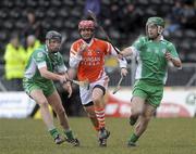 14 March 2010; Fiachra Bradley, Armagh, in action against Colm Forde and Gary Fitzgerald, London. Allianz GAA Hurling National League, Division 3A, Round 3, Armagh v London, St Oliver Plunkett Park, Crossmaglen, Co. Armagh. Picture credit: Oliver McVeigh / SPORTSFILE
