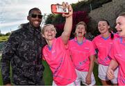 19 March 2016; Former Miami Dolphin NFL football player Roberto Wallace poses for a selfie with Valerie Mulcahy, Cork and 2015 All Stars, watched by her 2015 team-mates, from 3rd left, Ciara Hegarty, Donegal, Caroline Kelly, Kerry, and Geraldine McLaughlin, Donegal. TG4 Ladies Football All-Star Tour, 2014 All Stars v 2015 All Stars. University of San Diego, Torero Stadium, San Diego, California, USA. Picture credit: Brendan Moran / SPORTSFILE
