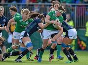 20 March 2016; Ailis Egan, Ireland, is tackled by Deborah McCormack and Jemma Forsyth, Scotland. Women's Six Nations Rugby Championship, Ireland v Scotland. Donnybrook Stadium, Donnybrook, Dublin. Picture credit: Seb Daly / SPORTSFILE