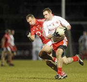 13 March 2010; Aidan Cassidy, Tyrone, in action against Alan O'Connor, Cork. Allianz GAA Football National League, Division 1, Round 4, Tyrone v Cork, Healy Park, Omagh, Co. Tyrone. Picture credit: Oliver McVeigh / SPORTSFILE