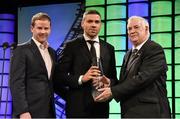20 March 2016; Republic of Ireland's Jonathan Walters is presented with the 3 FAI Senior International Player of the year Award by Gavin McAllister, left, PR & Sponsorship Manager at Three Ireland and FAI President Tony Fitzgerald. 3 FAI International Soccer Awards. RTE, Donnybrook, Dublin. Picture credit: David Maher / SPORTSFILE