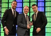 20 March 2016; Kenneth Hoey, Rockmount, Cork, is presented with the 3 FAI Intermediate Player of the Year award by republic of Ireland International's Richard Keogh and Seamus Coleman . 3 FAI International Soccer Awards. RTE, Donnybrook, Dublin. Picture credit: David Maher / SPORTSFILE