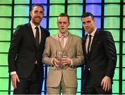 20 March 2016; Jimmy Carr, St. Michael's FC, is presented with the 3 FAI Junior International Player of the Year award  by Republic of Ireland International's Richard Keogh and Seamus Coleman. 3 FAI International Soccer Awards. RTE, Donnybrook, Dublin. Picture credit: David Maher / SPORTSFILE