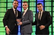 20 March 2016; Conor Ellis is presented with the 3 FAI Schools International player of the year award  by Republic of Ireland International's Richard Keogh and Seamus Coleman. 3 FAI International Soccer Awards. RTE, Donnybrook, Dublin. Picture credit: David Maher / SPORTSFILE