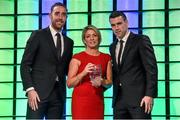 20 March 2016; Freda Connolly, mother of  Republic of Ireland's Megan Connolly, accepts her award for the 3 FAI Under 19 Women's International Player of the year award from Republic of Ireland International's Richard Keogh and Seamus Coleman. 3 FAI International Soccer Awards. RTE, Donnybrook, Dublin. Picture credit: David Maher / SPORTSFILE