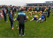 20 March 2016; Spectators look on as the Clare team stretch after the game. Allianz Hurling League, Division 1B, Round 5, Clare v Limerick. Cusack Park, Ennis, Co. Clare. Picture credit: Diarmuid Greene / SPORTSFILE